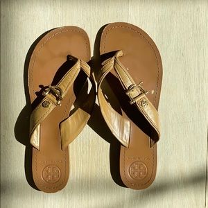 Tory Burch tan flat sandals.
